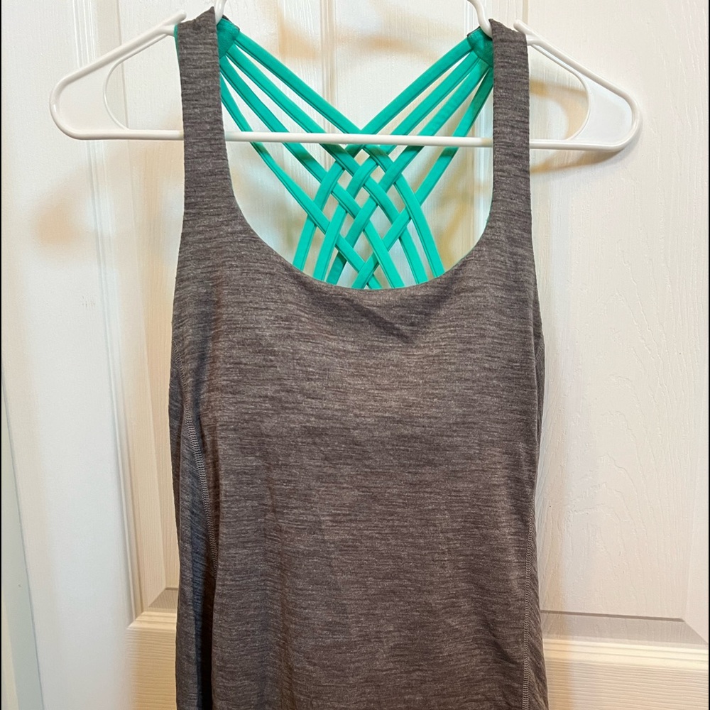 Lululemon tank top in green and grey. Built in bra in excellent condition